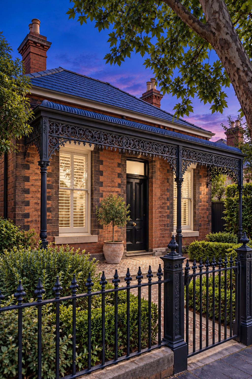 Red-brick Melbourne heritage home at simulated dusk